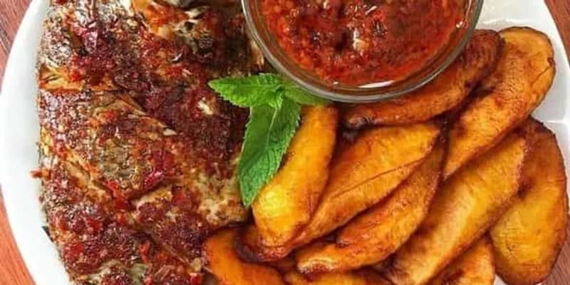 Grilled tilapia served with fried plantain
