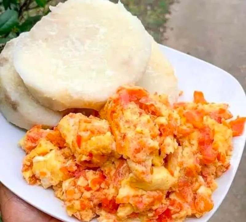 Boiled yam served with Nigerian egg sauce